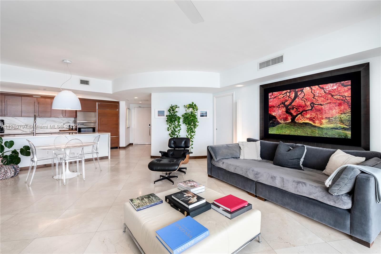 450 Alton Road, Unit 1404 Miami Beach, FL 33139 - Photo 9 of 33 a living room with furniture and a flat screen tv