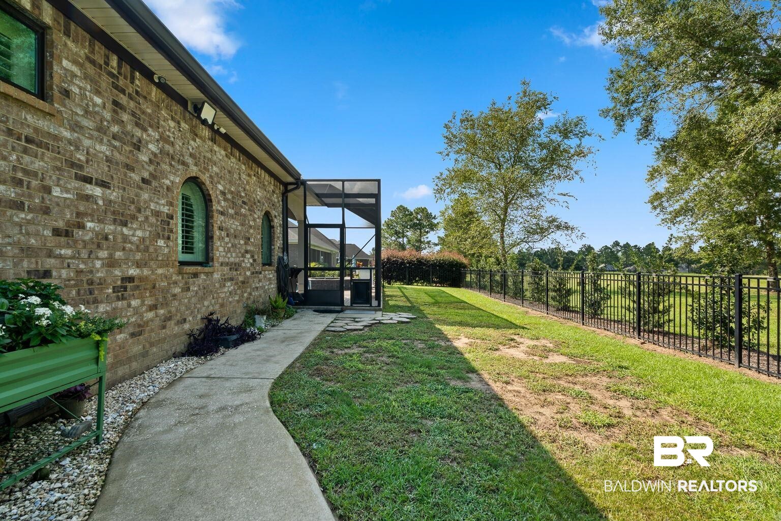 23357 Carnoustie Drive Foley, AL 36535 - Photo 78 of 99 Fenced backyard with glass enclosure