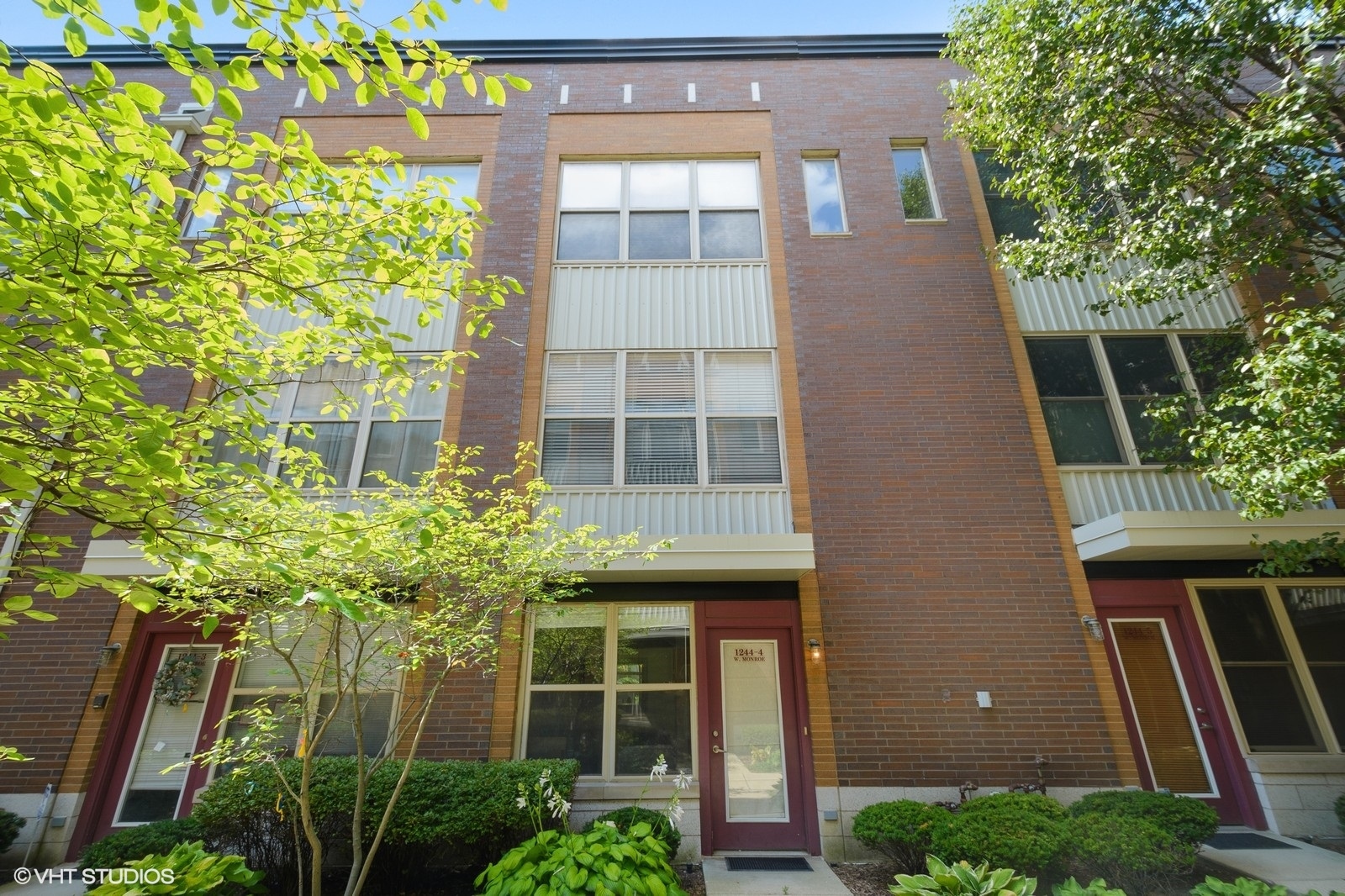 1244 West Monroe Street, Unit 4 Chicago, IL 60607 - Photo 1 of 16 a front view of a house with a yard