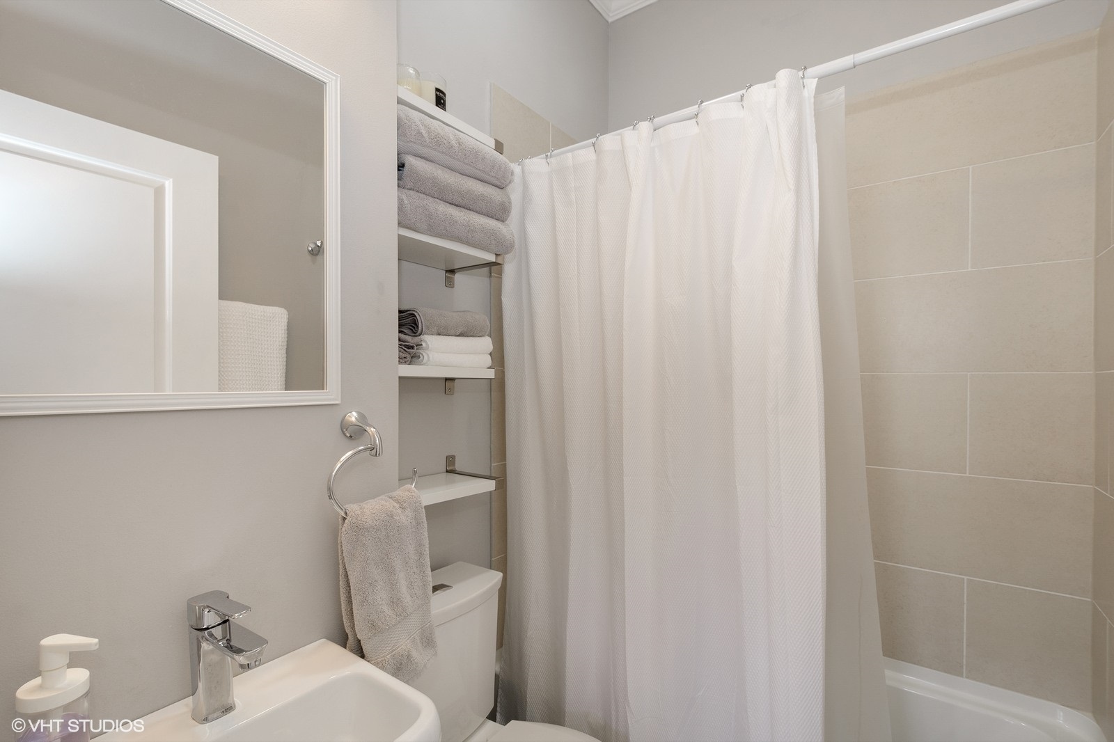 1244 West Monroe Street, Unit 4 Chicago, IL 60607 - Photo 14 of 16 a bathroom with a toilet and a shower curtain