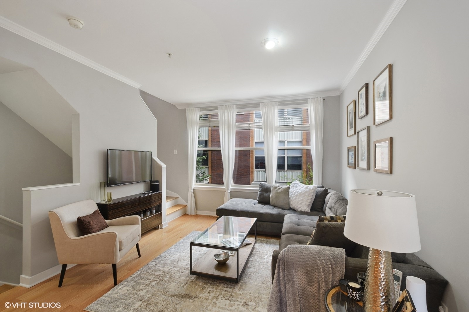 1244 West Monroe Street, Unit 4 Chicago, IL 60607 - Photo 3 of 16 a living room with furniture and a flat screen tv