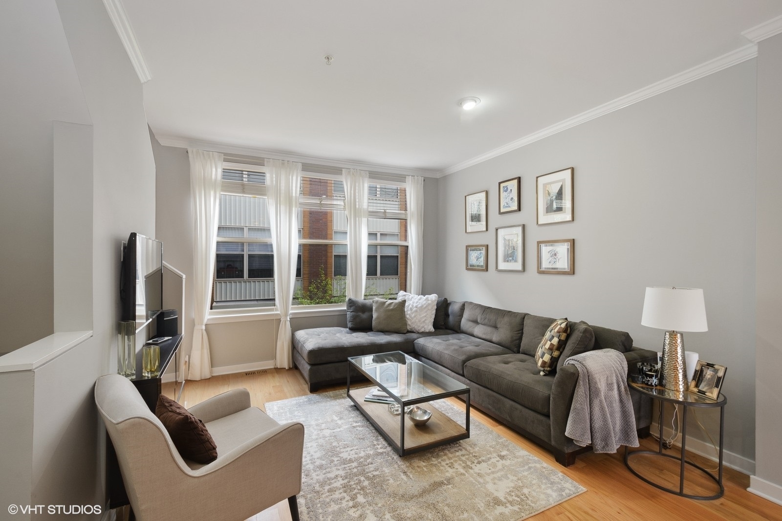 1244 West Monroe Street, Unit 4 Chicago, IL 60607 - Photo 4 of 16 a living room with furniture and a window