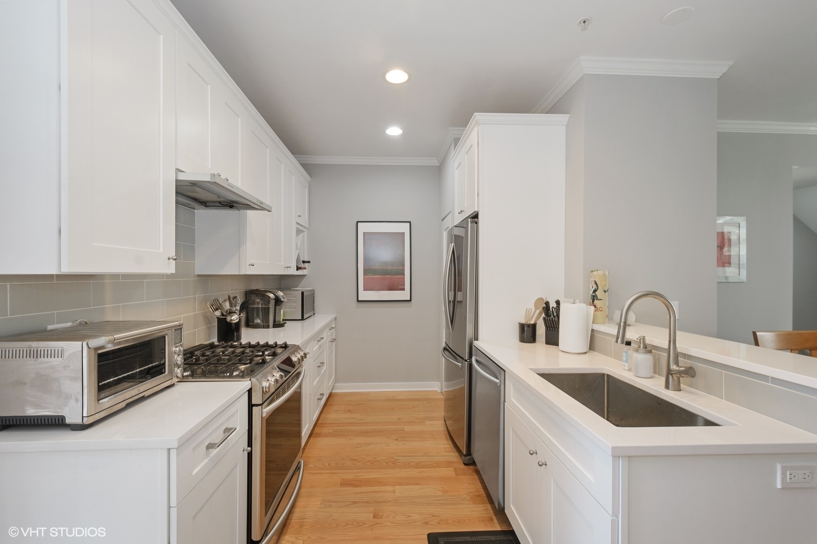 1244 West Monroe Street, Unit 4 Chicago, IL 60607 - Photo 6 of 16 a kitchen with a sink stove and refrigerator