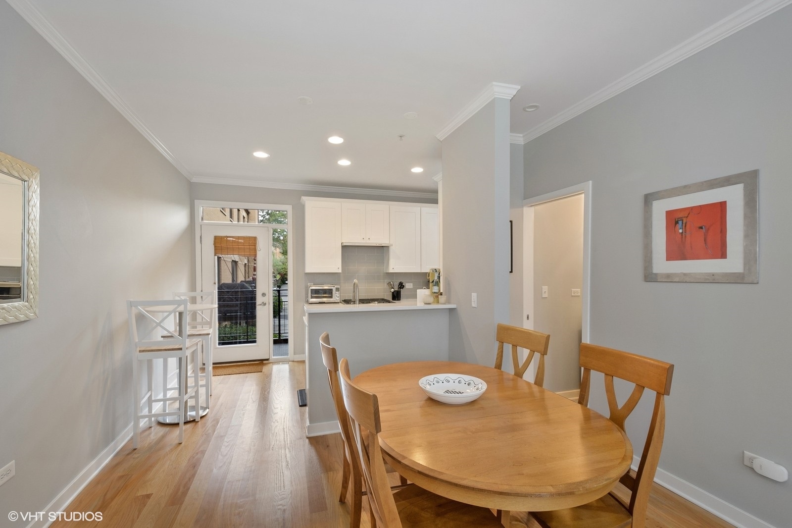 1244 West Monroe Street, Unit 4 Chicago, IL 60607 - Photo 8 of 16 a view of a dining room with furniture and wooden floor
