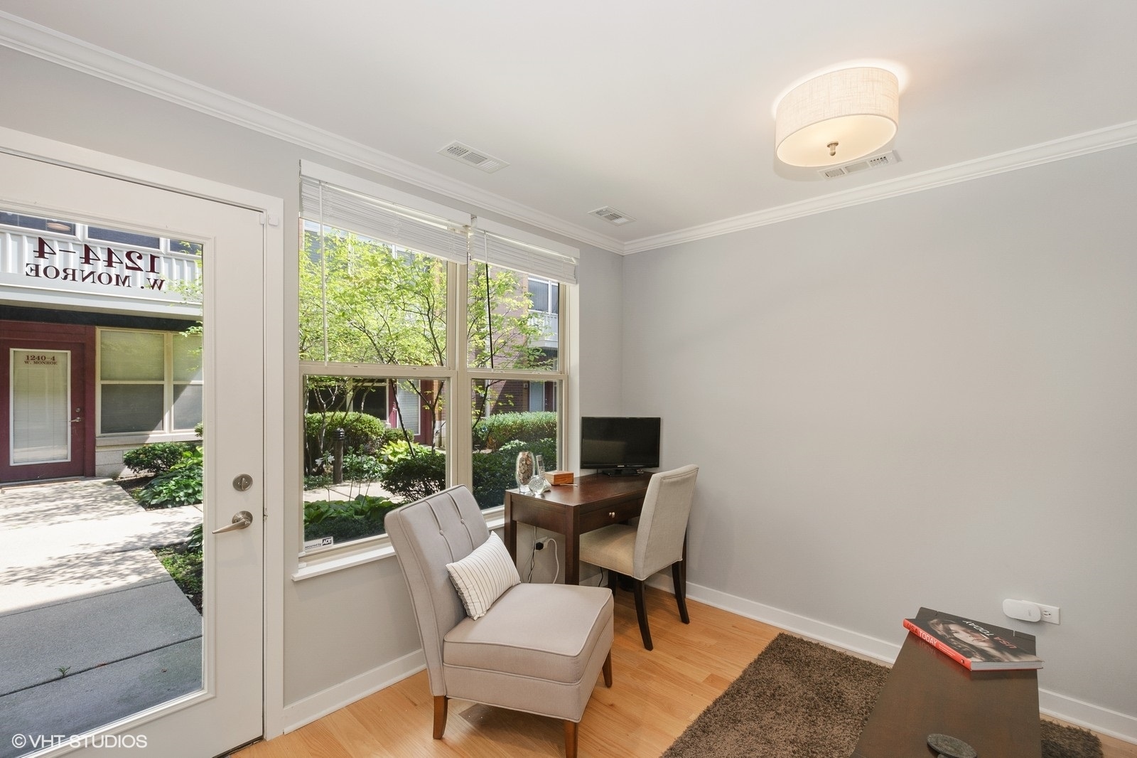 1244 West Monroe Street, Unit 4 Chicago, IL 60607 - Photo 9 of 16 a view of a workspace with furniture and a window