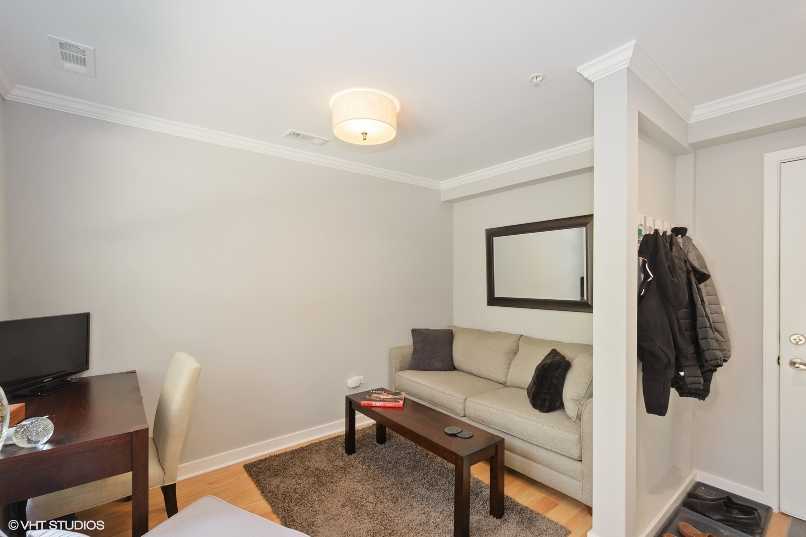 1244 West Monroe Street, Unit 4 Chicago, IL 60607 - Photo 10 of 16 a living room with furniture and a rug