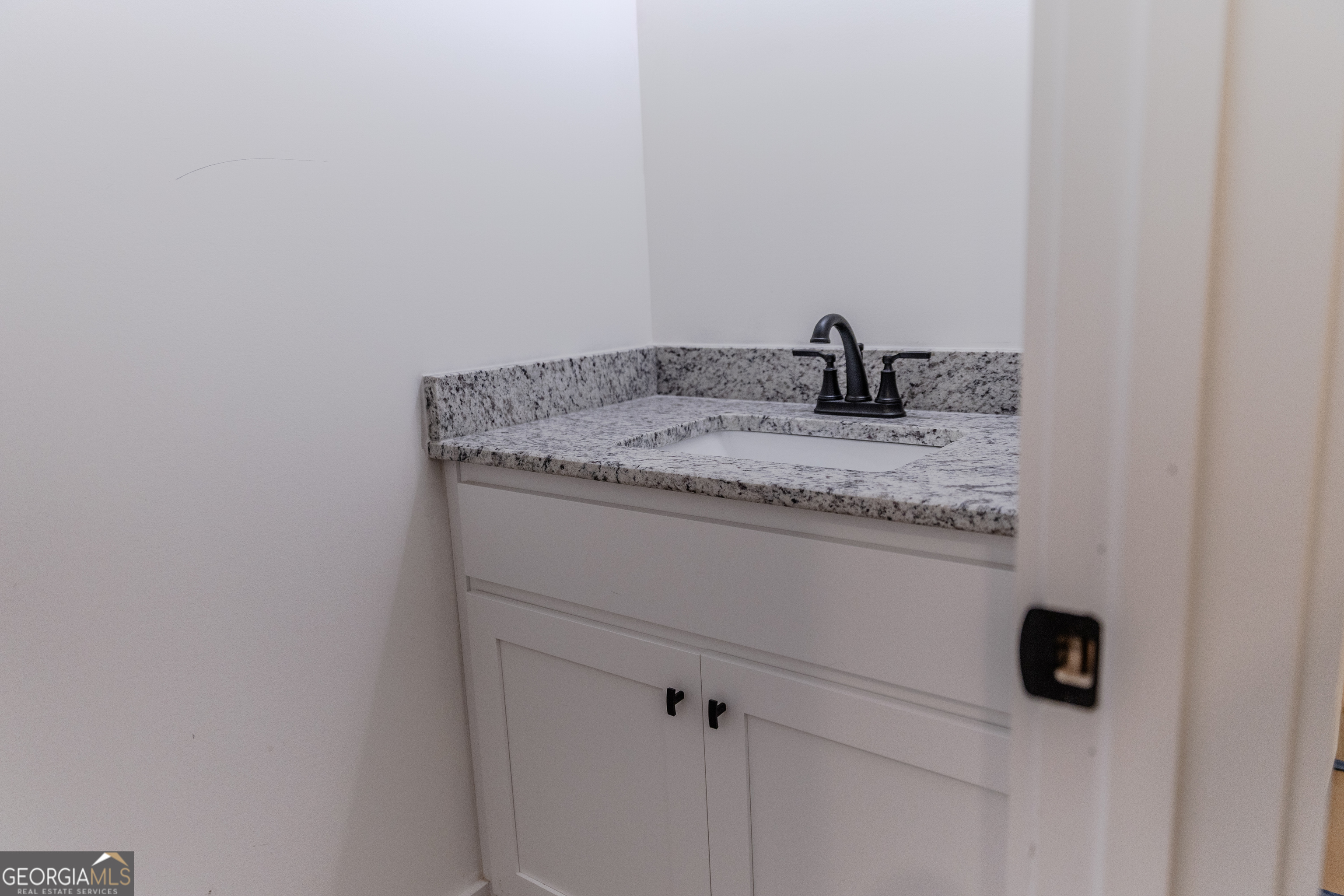 632 Campbell Road Covington, GA 30014 - Photo 16 of 60 a close view of a sink and tap