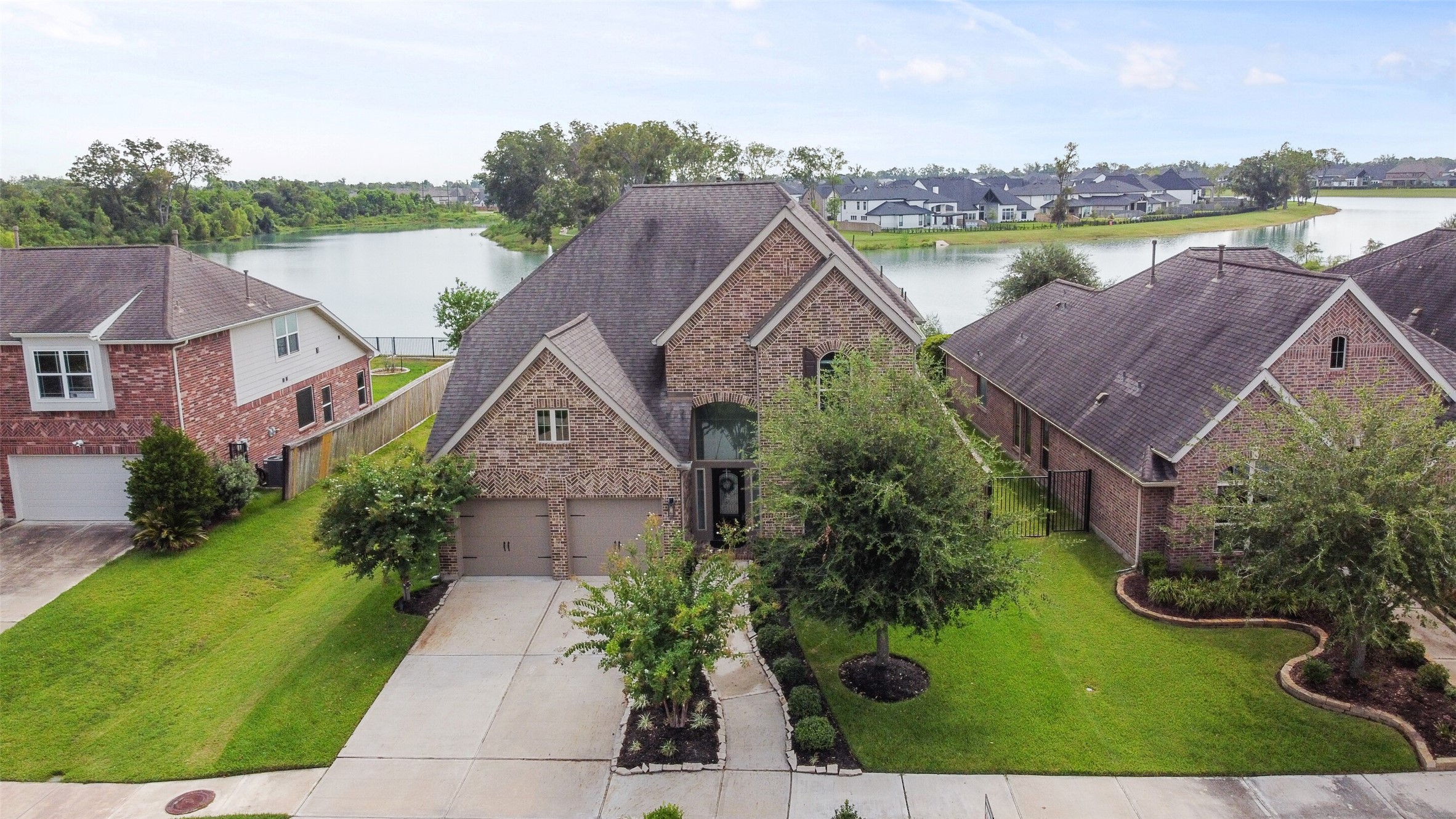 2707 River Run Road Missouri City, TX 77459 - Photo 1 of 45 an aerial view of a house with outdoor space and lake view