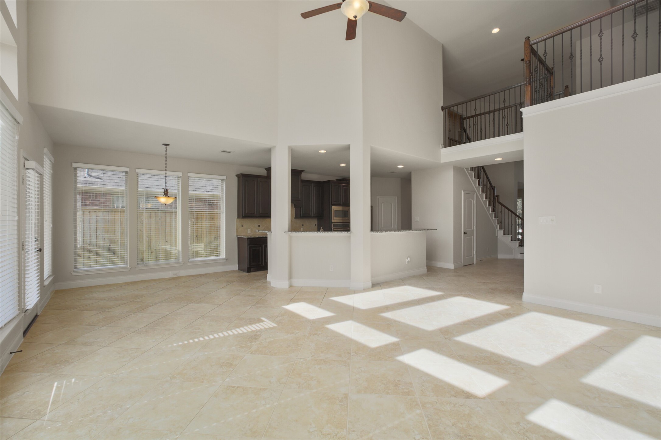 2707 River Run Road Missouri City, TX 77459 - Photo 12 of 45 a view of an empty room with kitchen and a window