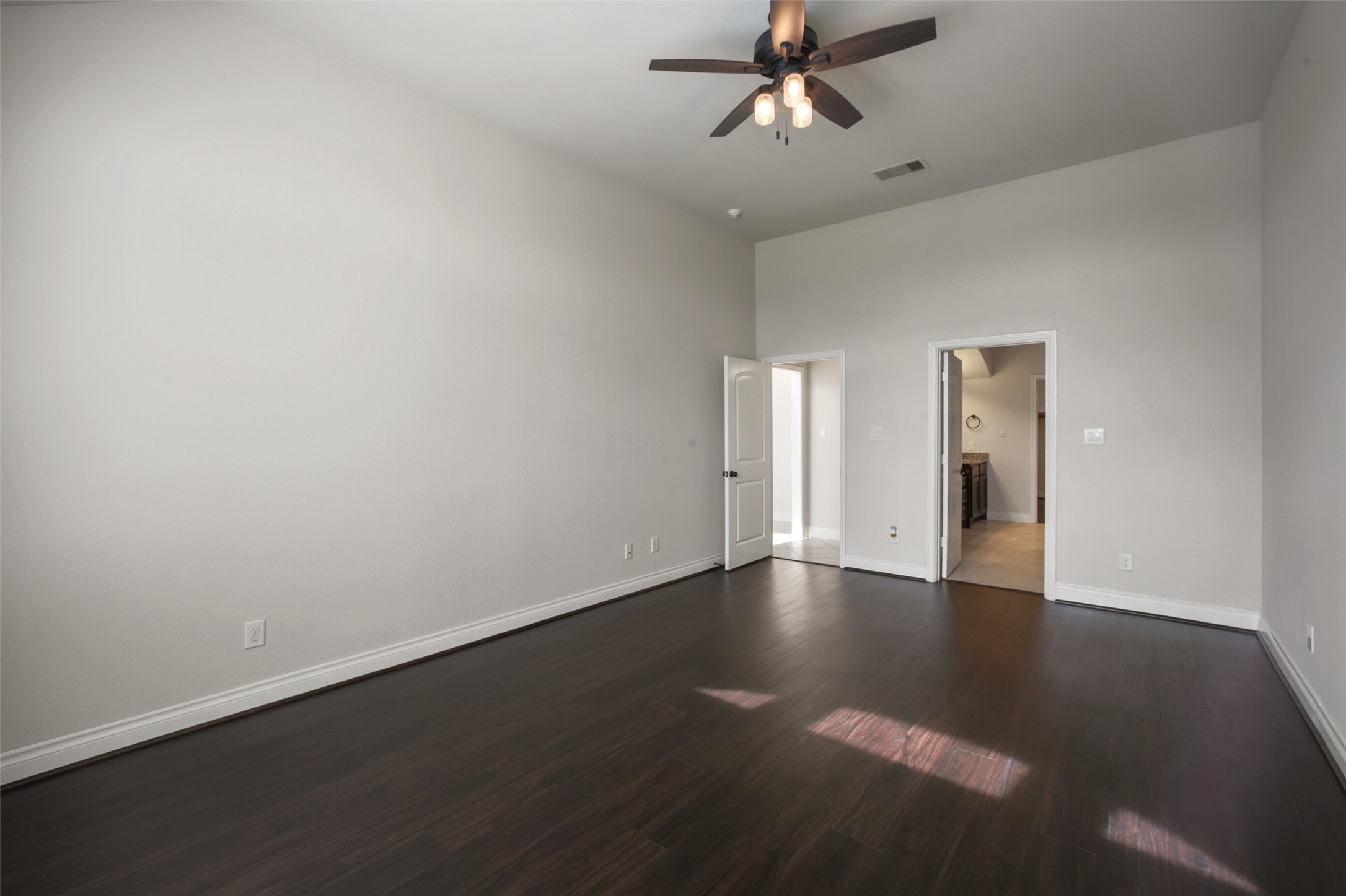 2707 River Run Road Missouri City, TX 77459 - Photo 21 of 45 an empty room with wooden floor closet and windows
