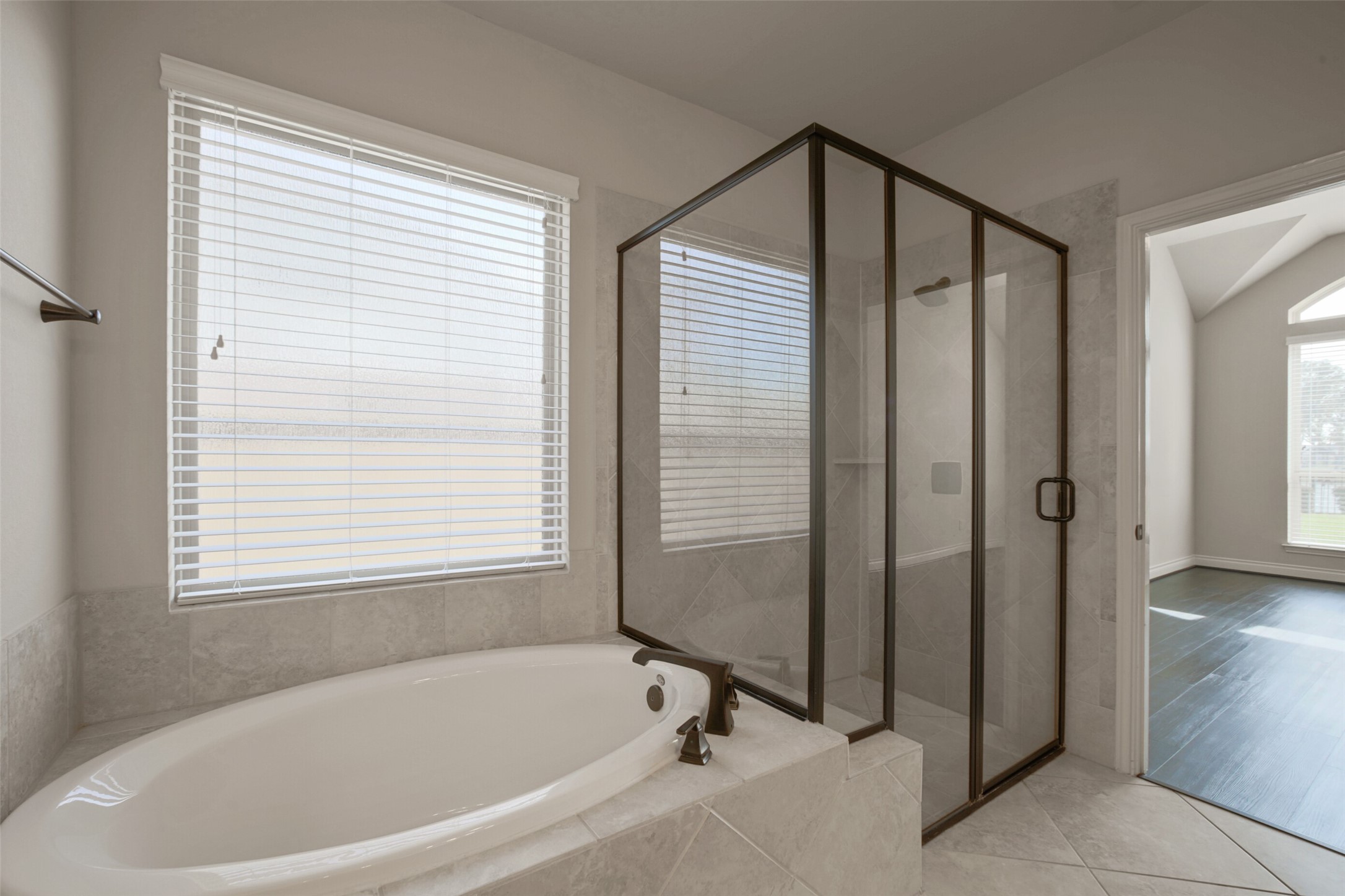 2707 River Run Road Missouri City, TX 77459 - Photo 23 of 45 a bathroom with a bathtub and a shower