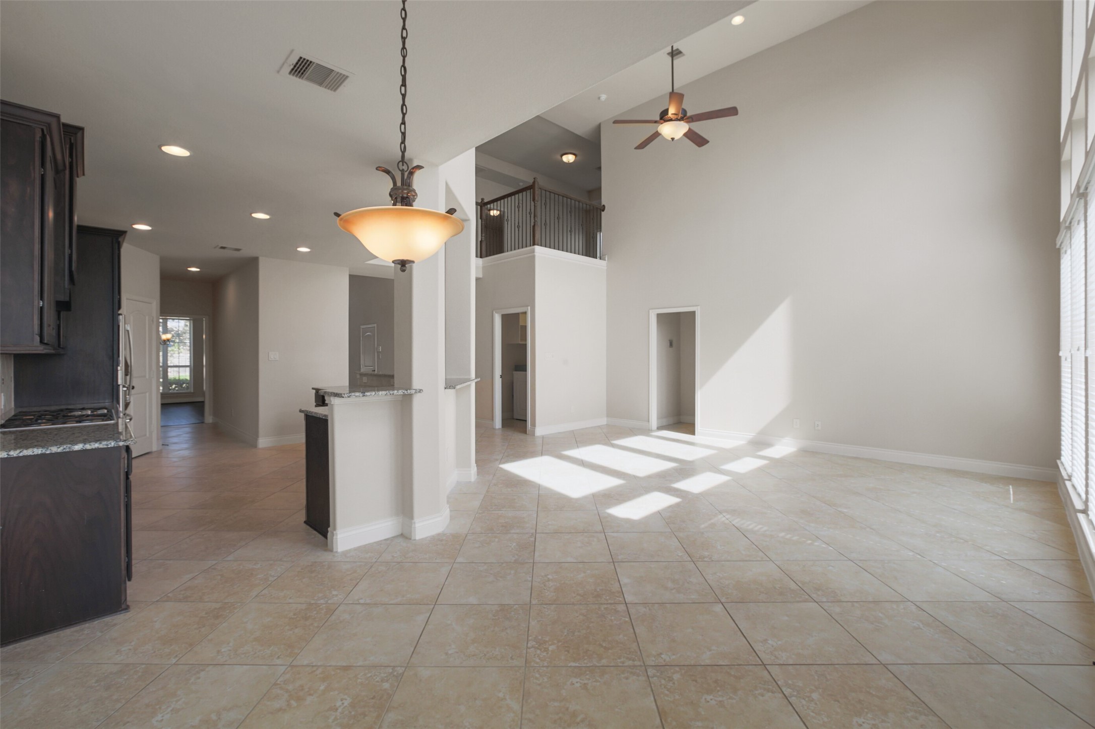2707 River Run Road Missouri City, TX 77459 - Photo 28 of 45 a view of a kitchen and a refrigerator