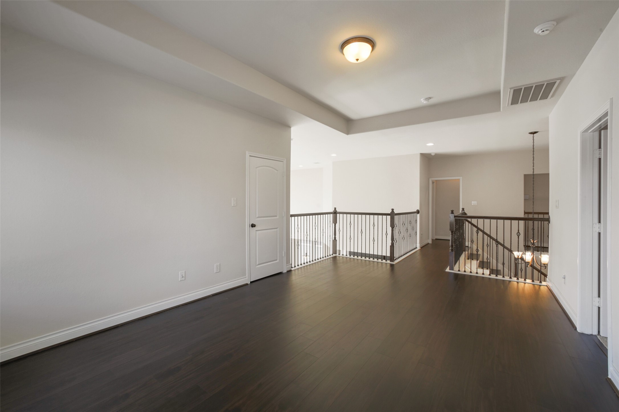 2707 River Run Road Missouri City, TX 77459 - Photo 31 of 45 an empty room with wooden floor and windows