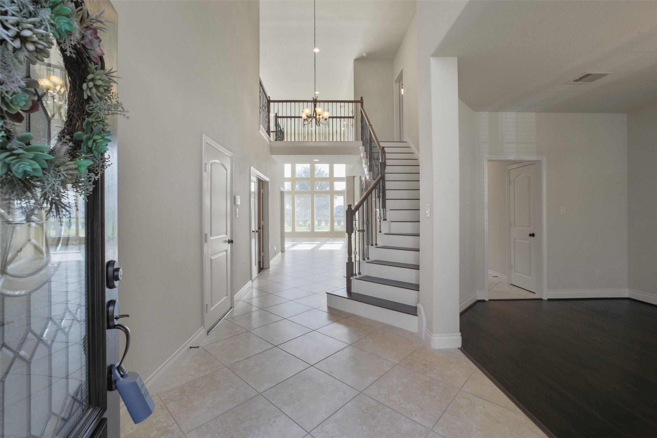 2707 River Run Road Missouri City, TX 77459 - Photo 8 of 45 a view of a hallway with wooden floor and staircase