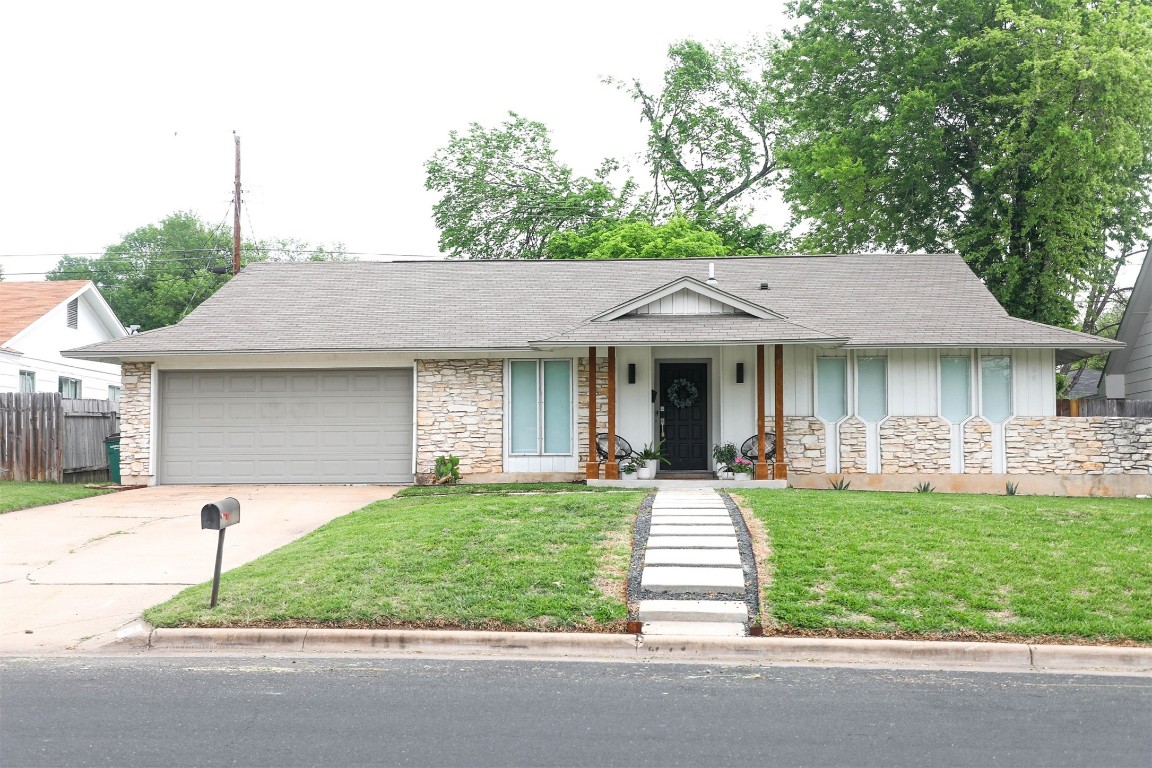 7301 Geneva Drive Austin, TX 78723 - Photo 1 of 1 a front view of a house with a yard and garage