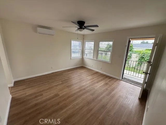 11222 Concert Street El Monte, CA 91731 - Photo 1 of 15 an empty room with wooden floor and windows