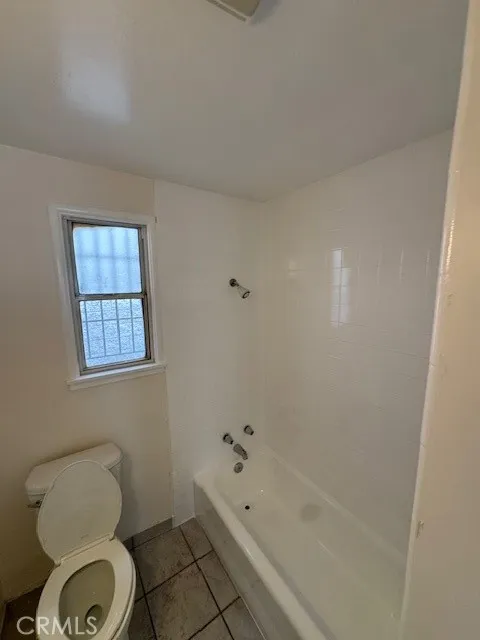 11222 Concert Street El Monte, CA 91731 - Photo 13 of 15 a bathroom with a toilet a sink and bathtub