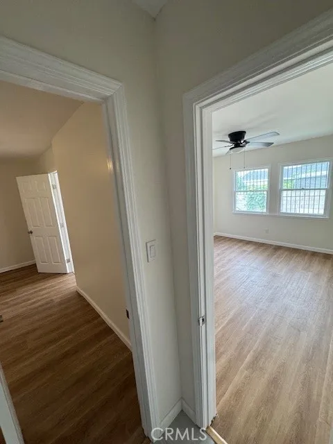 11222 Concert Street El Monte, CA 91731 - Photo 7 of 15 a view of a hallway view with wooden floor and front door