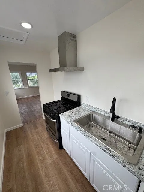 11222 Concert Street El Monte, CA 91731 - Photo 10 of 15 a kitchen with a stove and a sink
