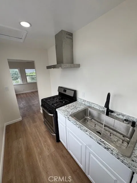 11222 Concert Street El Monte, CA 91731 - Photo 10 of 15 a kitchen with a stove and a sink