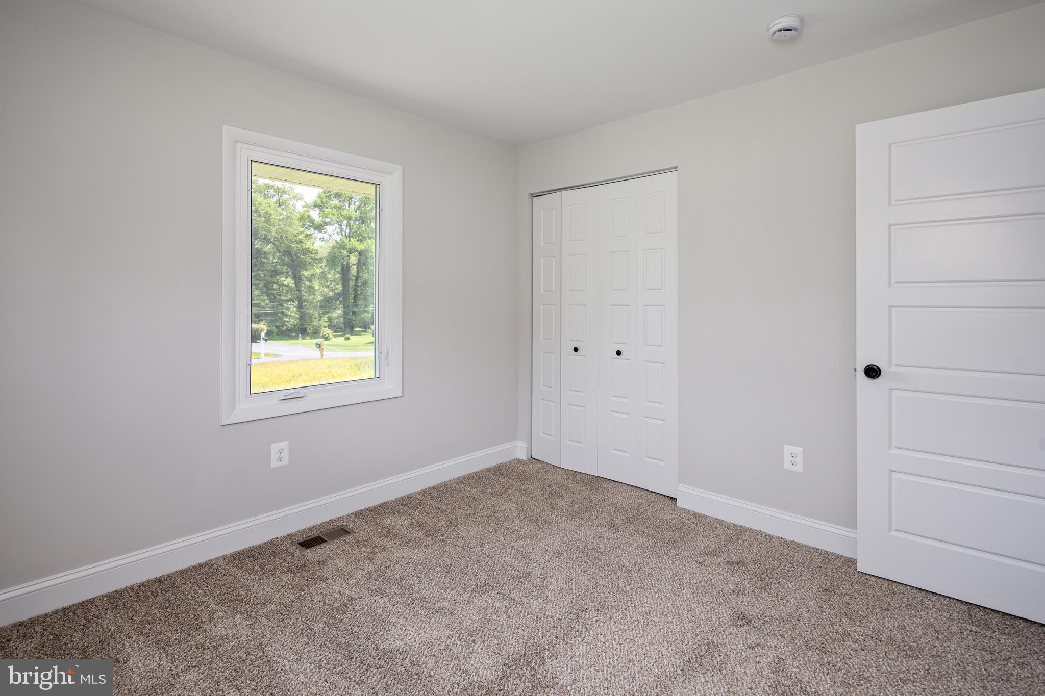 2400 Stoneybrook Road Fallston, MD 21047 - Photo 14 of 45 an empty room with windows and closet