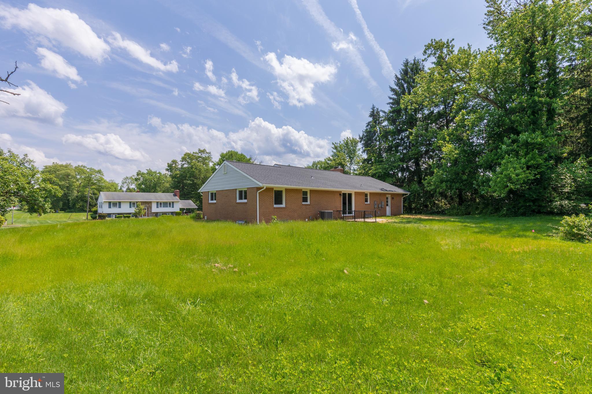 2400 Stoneybrook Road Fallston, MD 21047 - Photo 42 of 45 a front view of house with yard and trees in the background