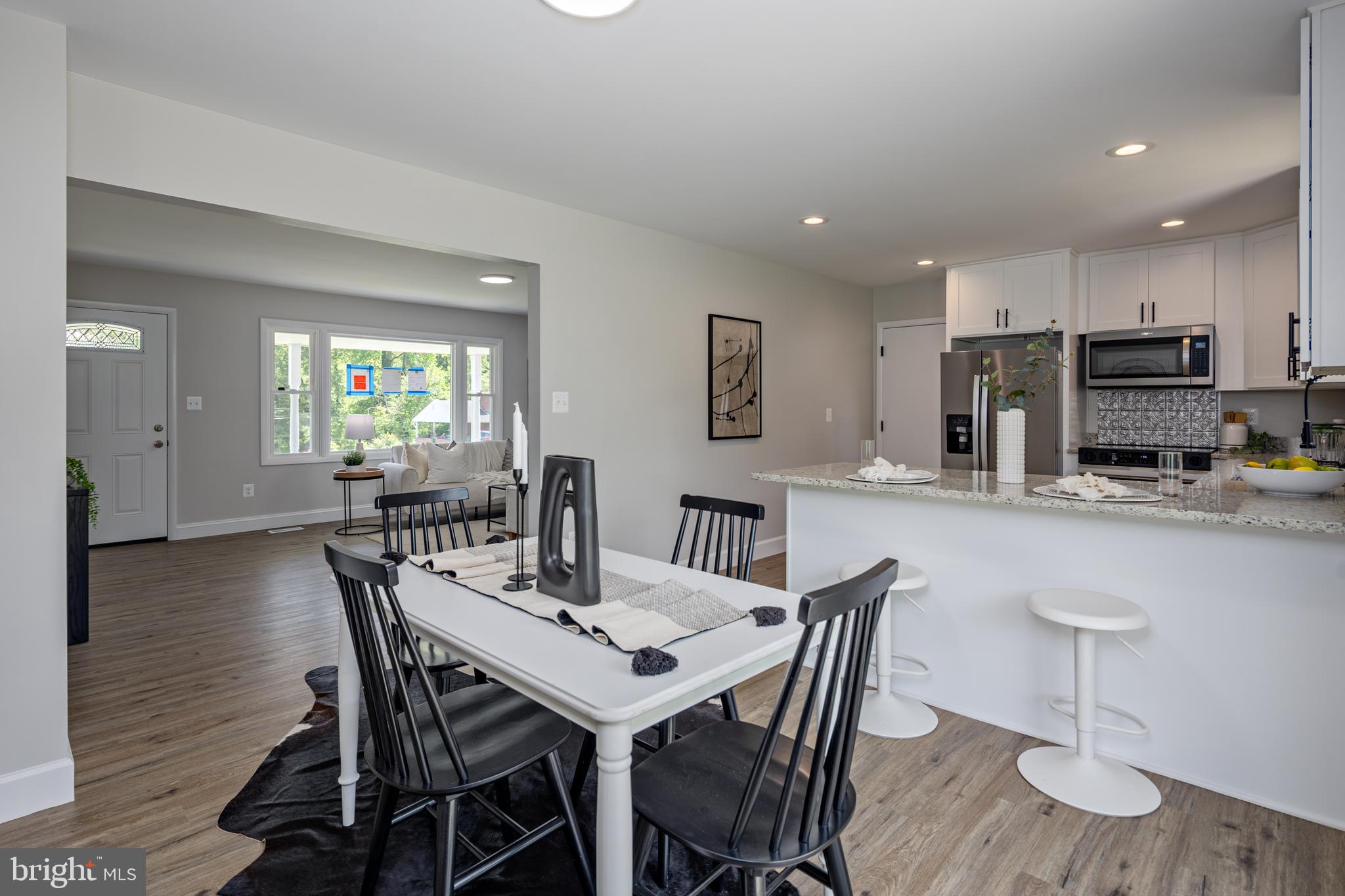 2400 Stoneybrook Road Fallston, MD 21047 - Photo 8 of 45 a view of a dining room with furniture and wooden floor