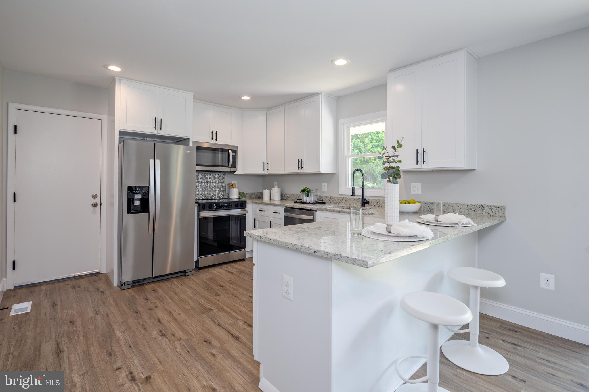 2400 Stoneybrook Road Fallston, MD 21047 - Photo 10 of 45 a kitchen with stainless steel appliances granite countertop a refrigerator and a stove top oven
