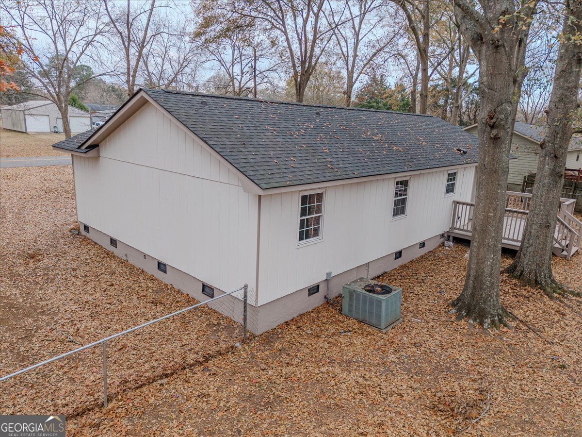 111 Collins Street Byron, GA 31008 - Photo 26 of 26 a view of a house with a yard and garage