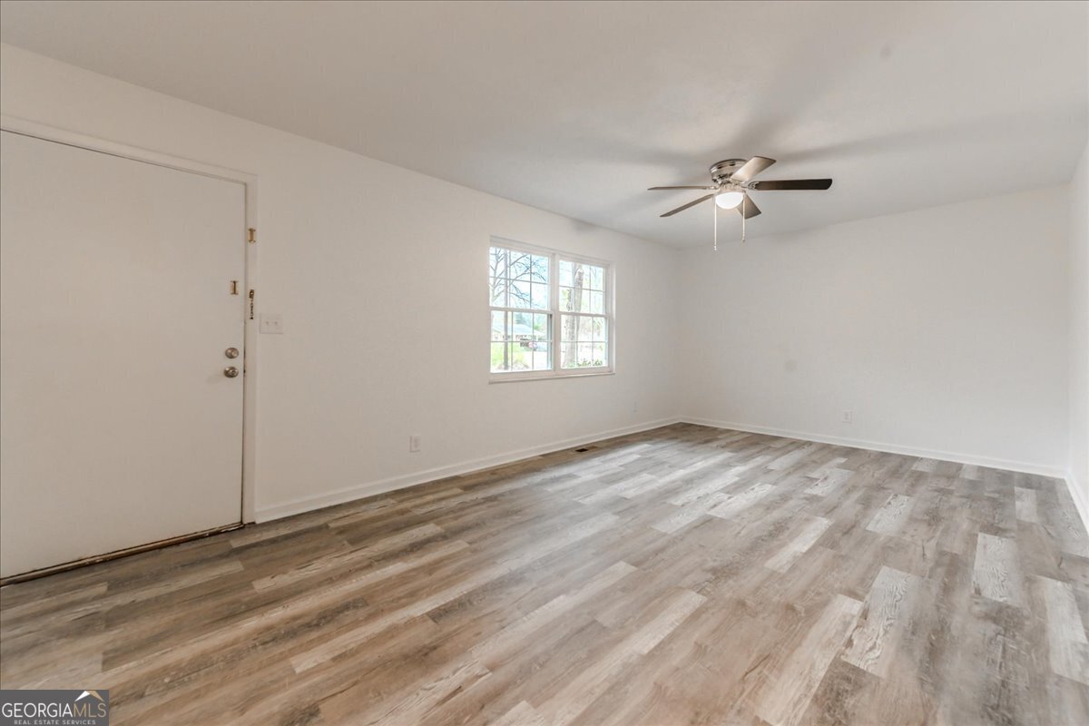 111 Collins Street Byron, GA 31008 - Photo 5 of 26 a view of empty room with ceiling fan
