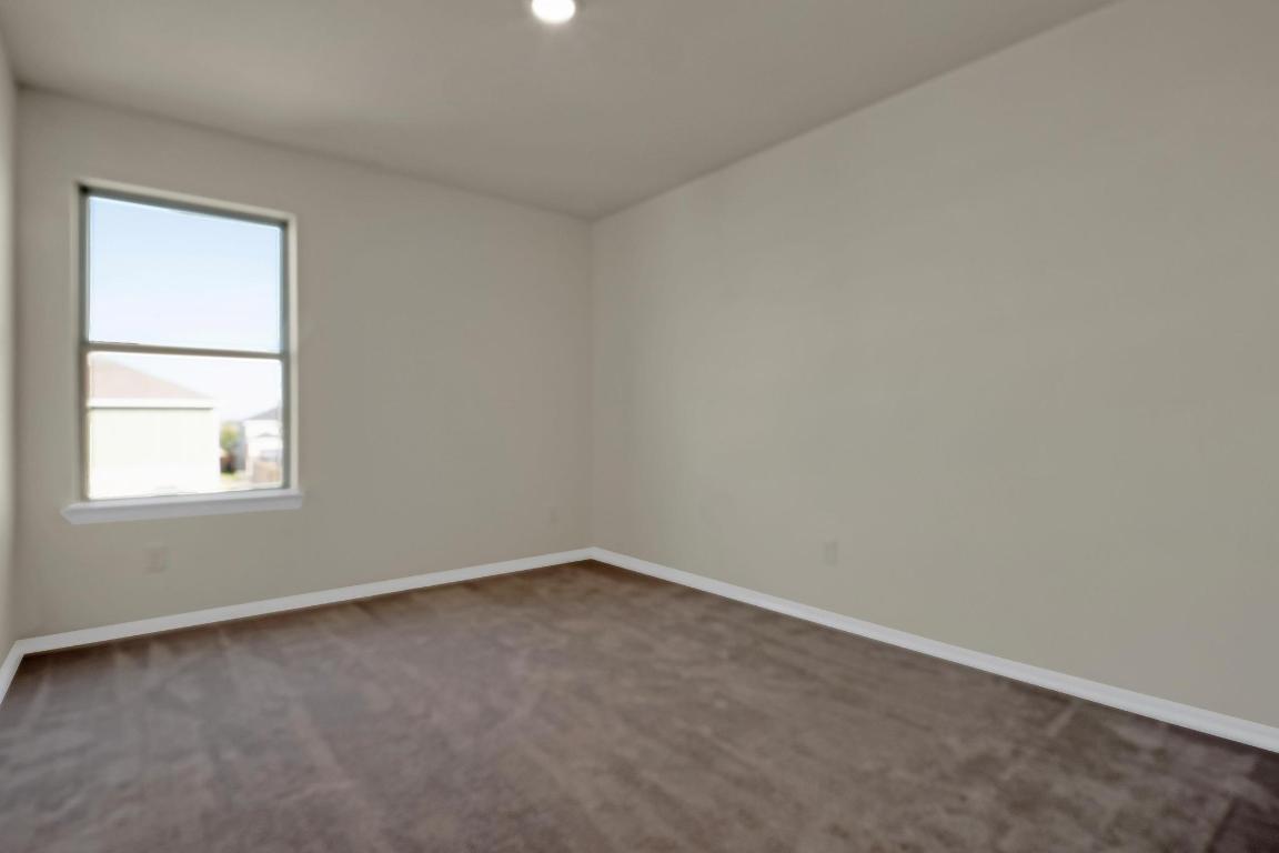 449 Stone Water Lane Jarrell, TX 76537 - Photo 15 of 21 an empty room with a window