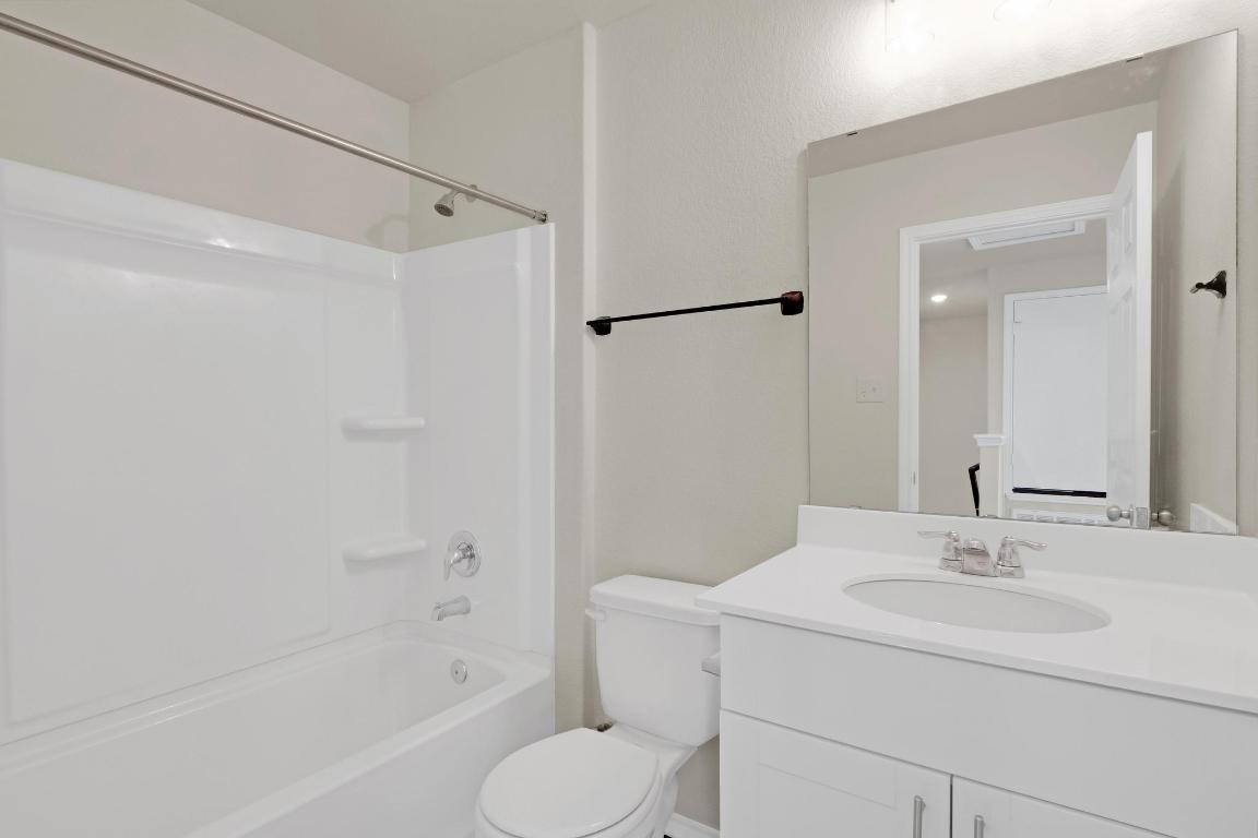 449 Stone Water Lane Jarrell, TX 76537 - Photo 18 of 21 a bathroom with a sink toilet and shower