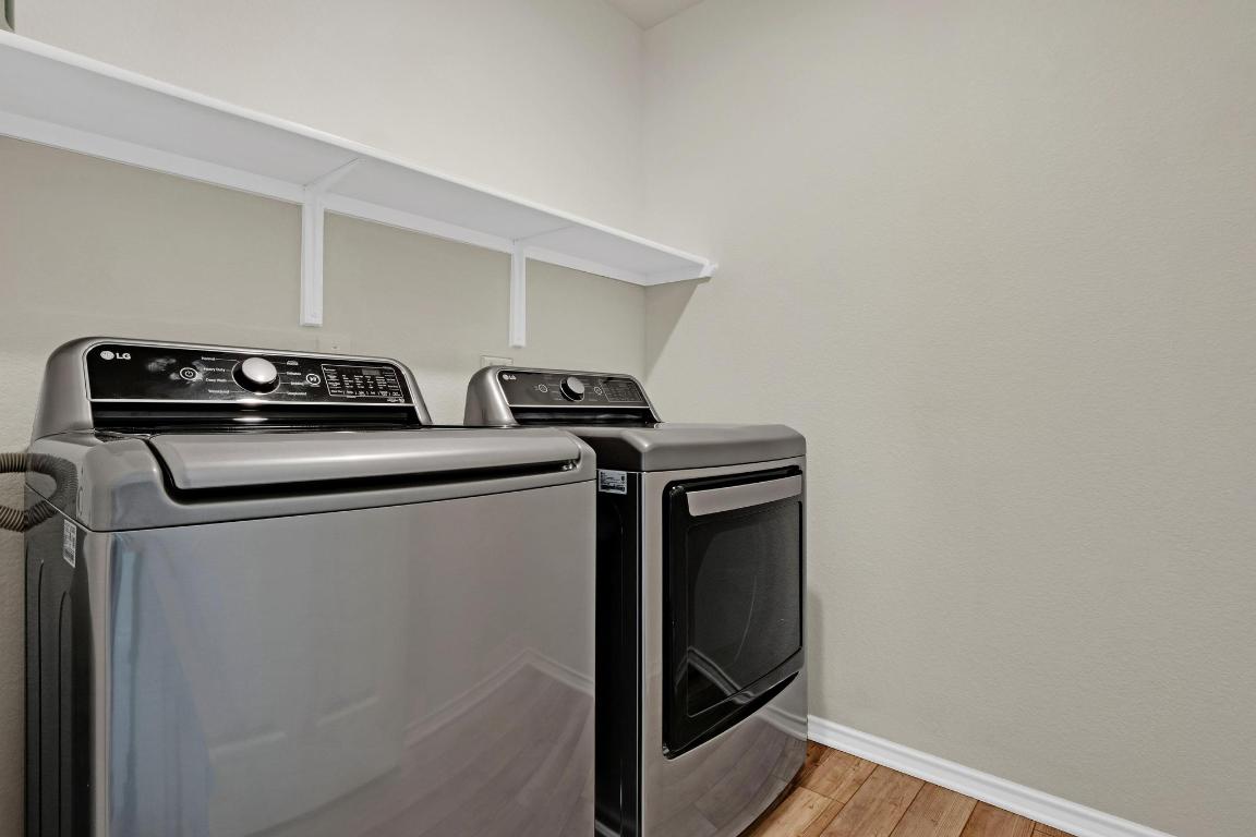 449 Stone Water Lane Jarrell, TX 76537 - Photo 19 of 21 a utility room with dryer and washer