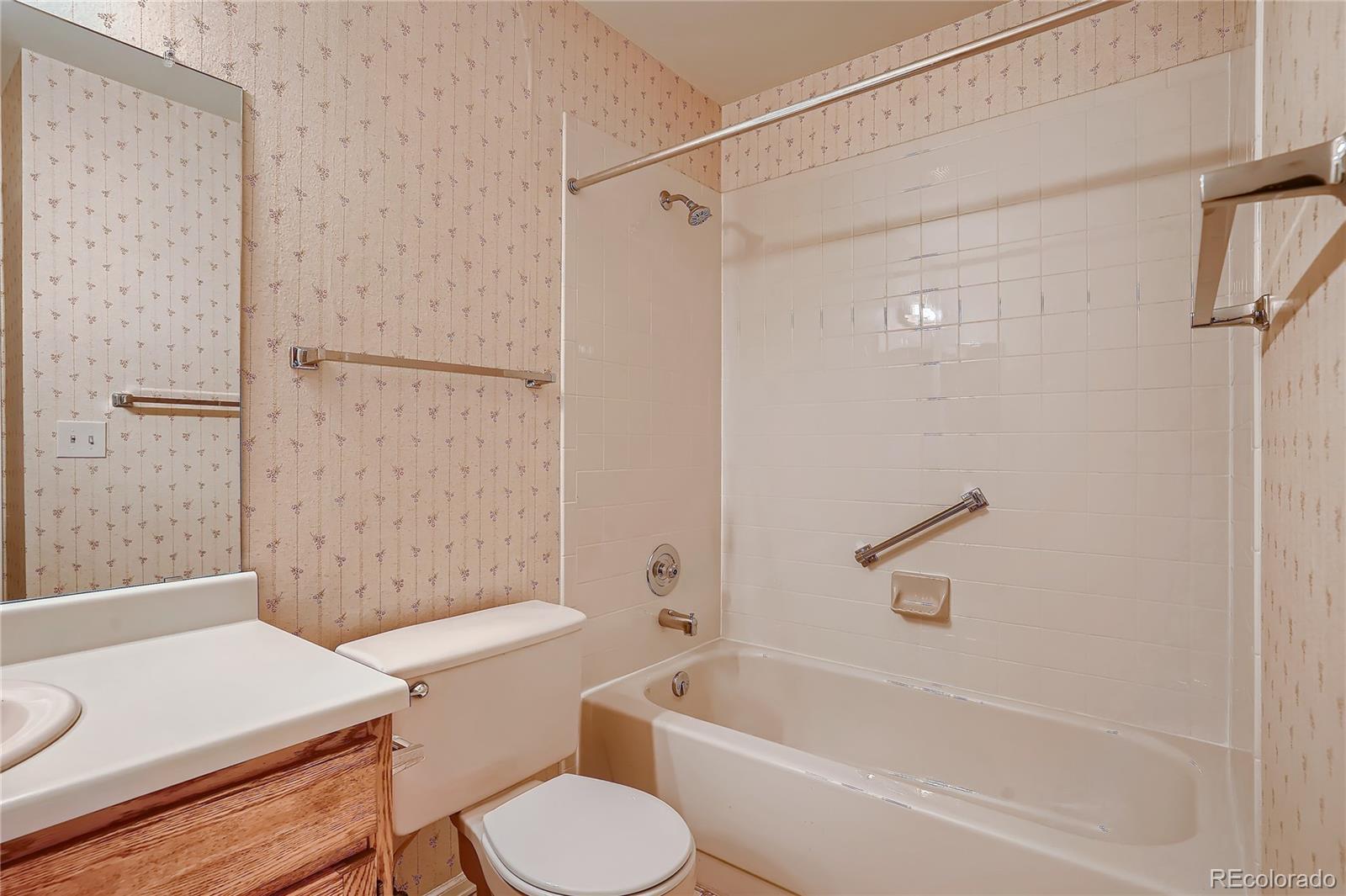 6 Shetland Court Highlands Ranch, CO 80130 - Photo 26 of 33 a bathroom with a sink a toilet and a bathtub