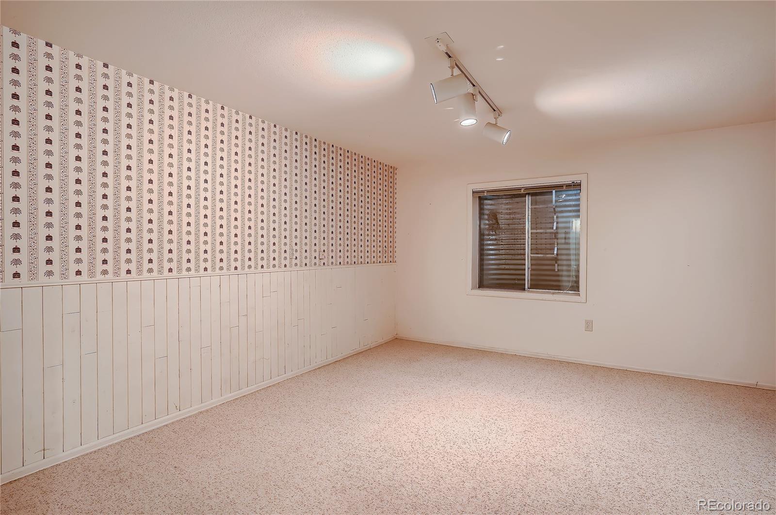 6 Shetland Court Highlands Ranch, CO 80130 - Photo 27 of 33 an empty room with windows