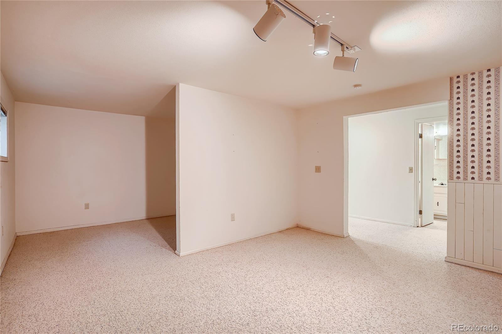 6 Shetland Court Highlands Ranch, CO 80130 - Photo 28 of 33 an empty room with ceiling fan and windows