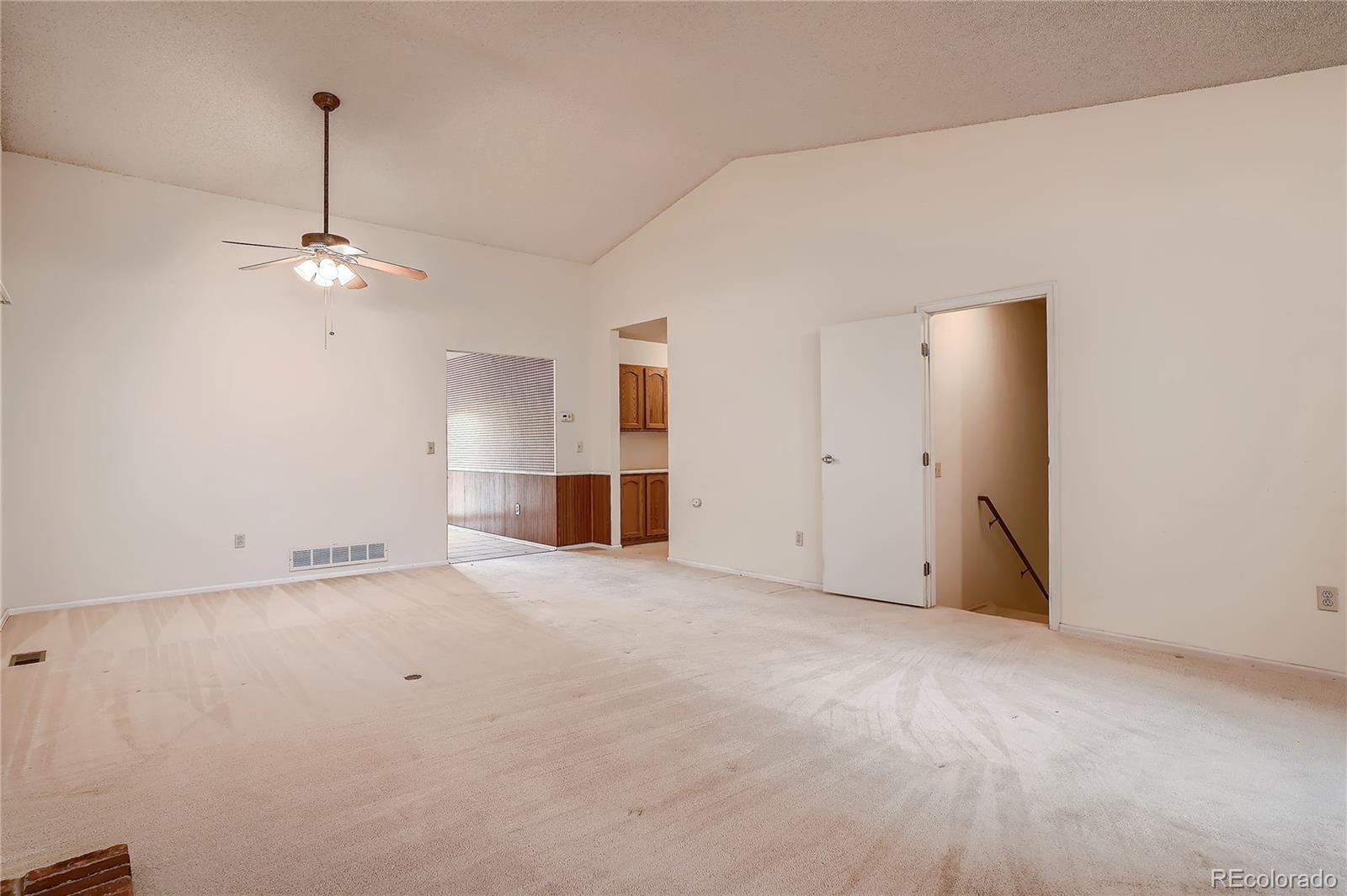 6 Shetland Court Highlands Ranch, CO 80130 - Photo 9 of 33 a view of an empty room with a ceiling fan