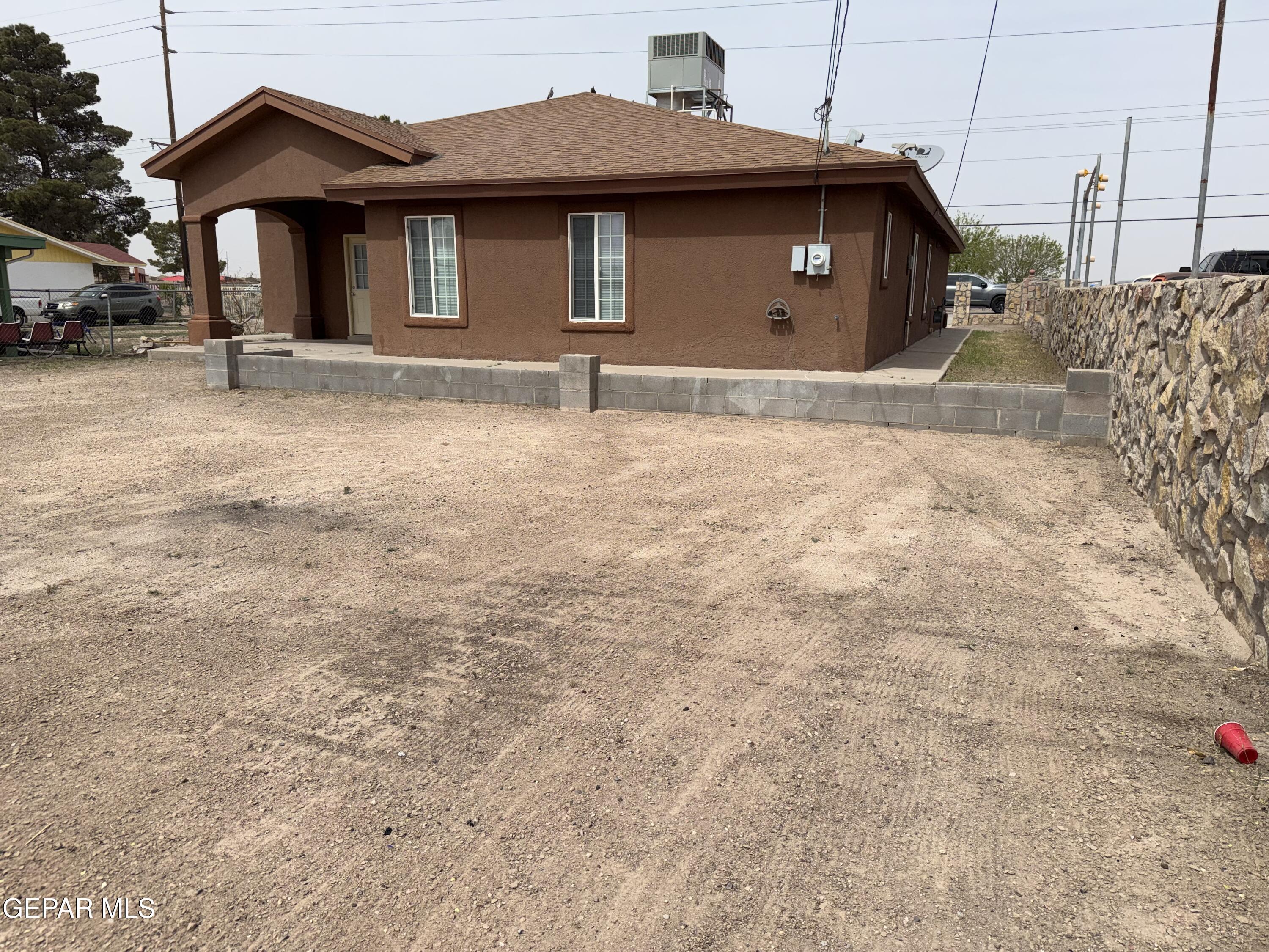 456 Passmore Road Socorro, TX 79927 - Photo 21 of 23 a front view of a house with a yard