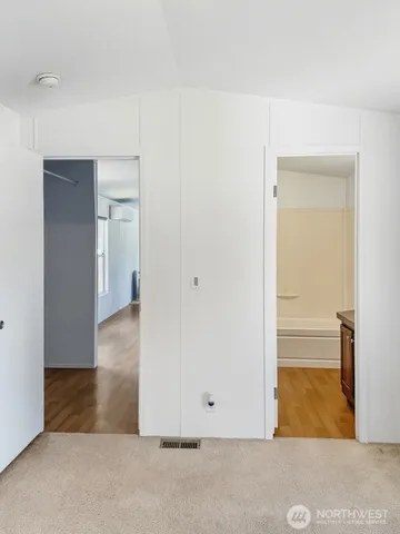 an empty room with wooden door