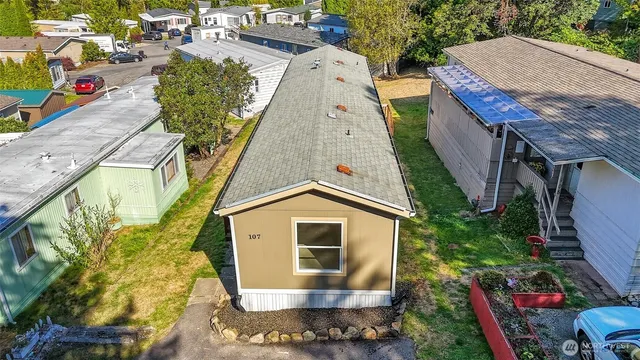 an aerial view of a house with swimming pool