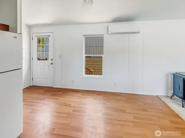 a view of an empty room with a window