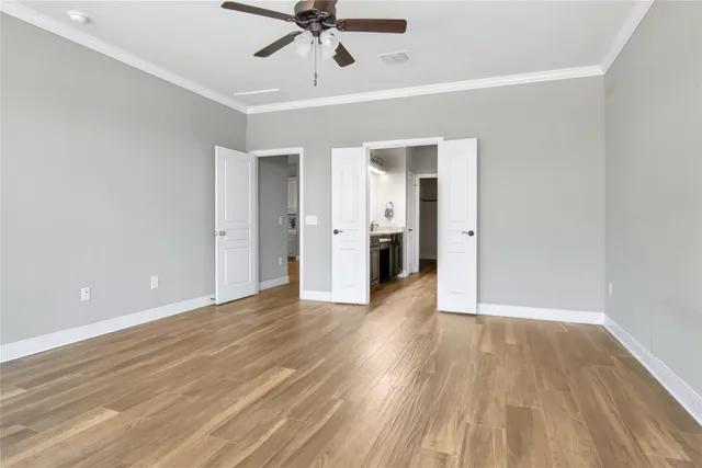 a spacious bathroom with a granite countertop sink a mirror and a shower