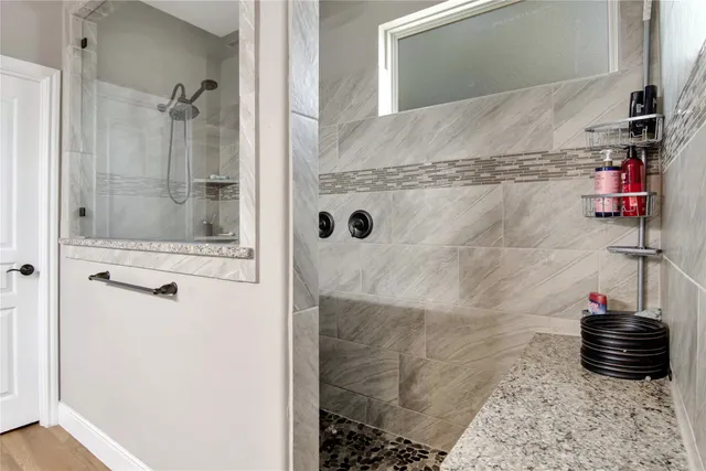 a room with a dresser with a wooden floor