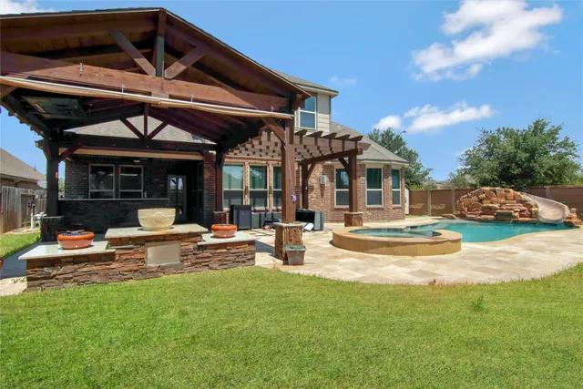 a view of a swimming pool with a patio