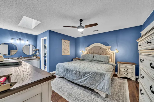 a bedroom with a bed and a dresser