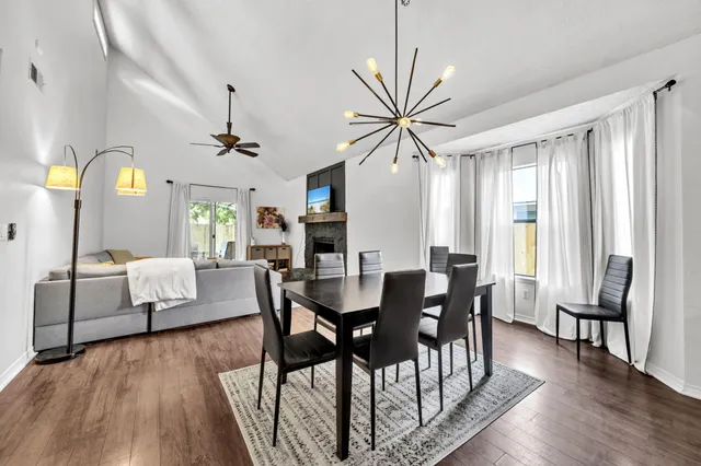 a view of a dining room with furniture window and wooden floor