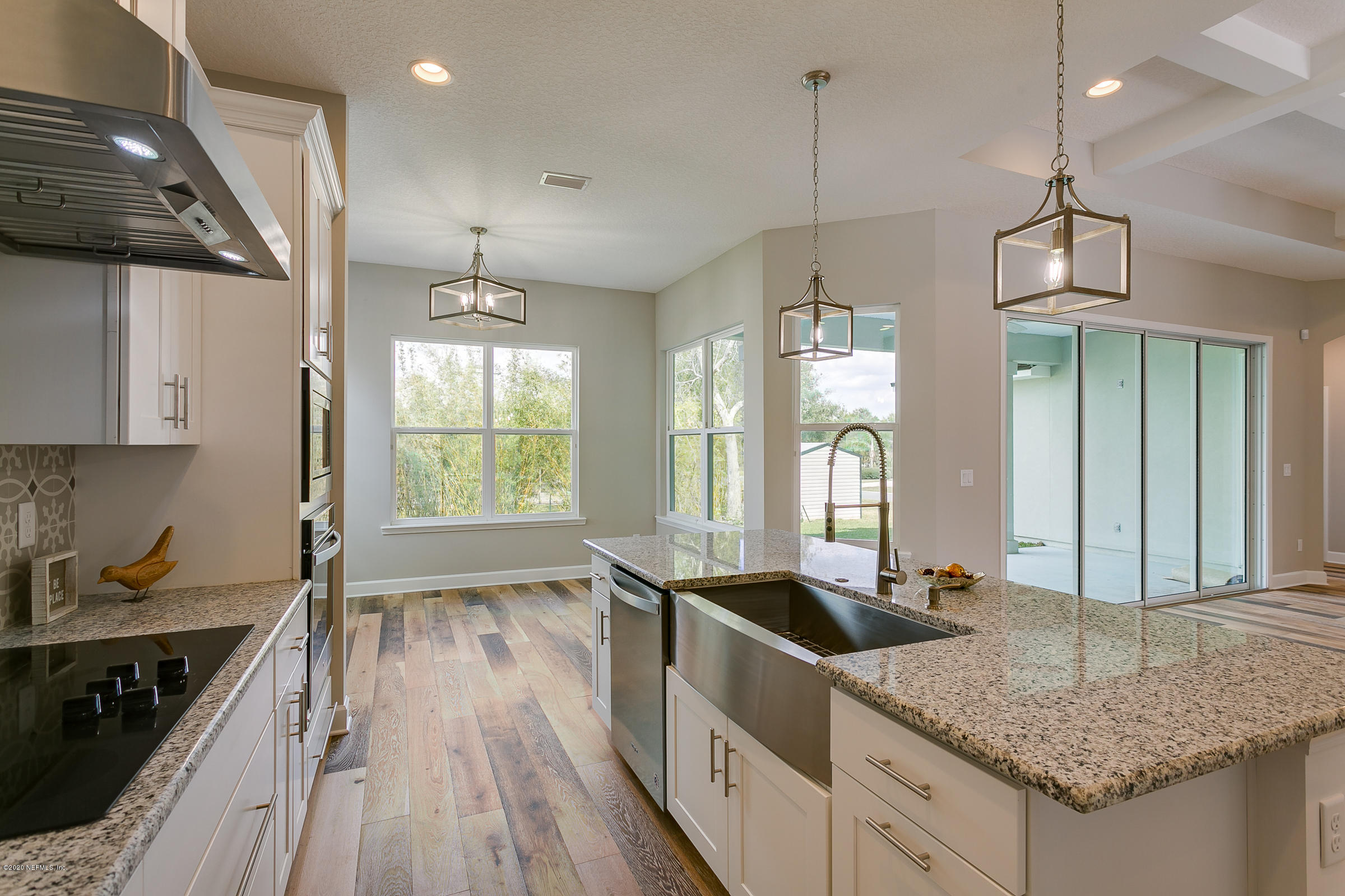 596 West Bianca Circle St. Augustine, FL 32086 - Photo 16 of 37 a kitchen that has a lot of cabinets in it