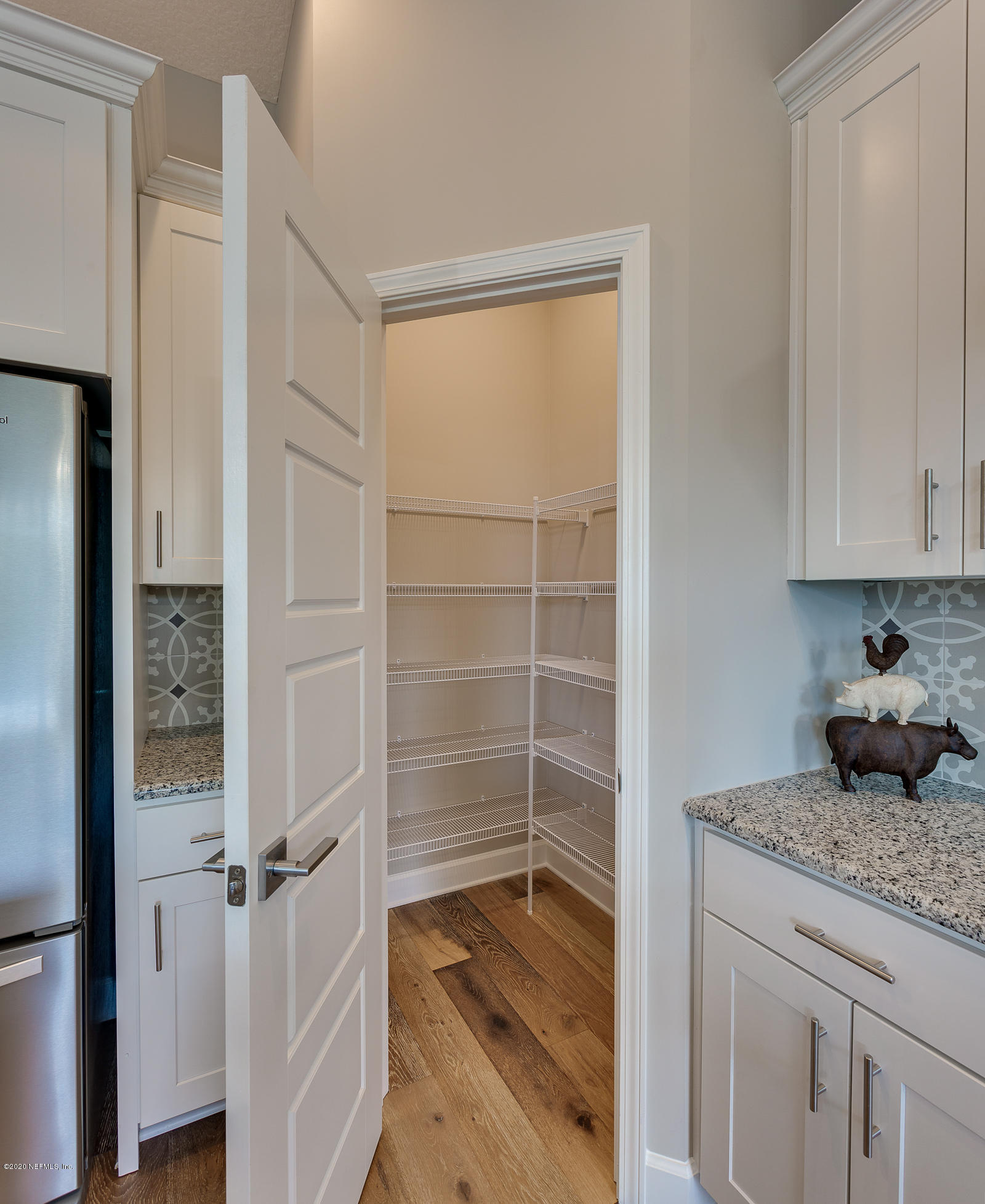 596 West Bianca Circle St. Augustine, FL 32086 - Photo 17 of 37 a bathroom with a granite countertop sink and a mirror