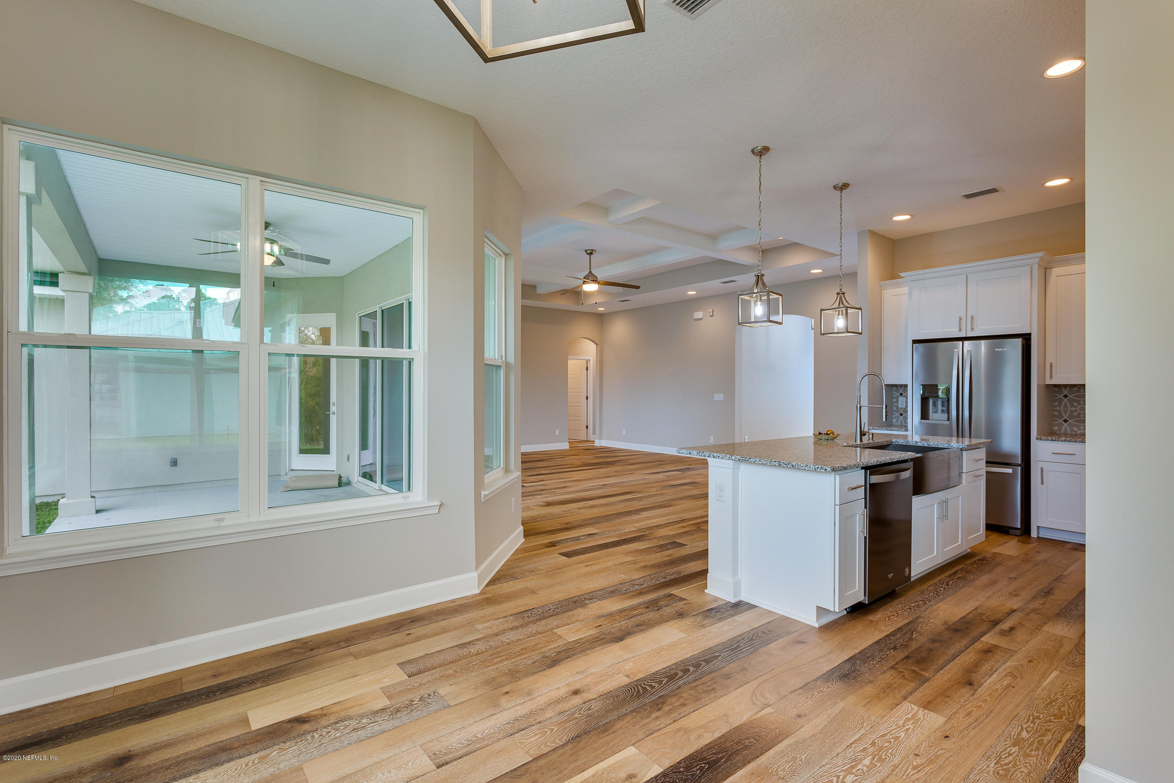596 West Bianca Circle St. Augustine, FL 32086 - Photo 19 of 37 a large kitchen with kitchen island a sink stainless steel appliances and cabinets