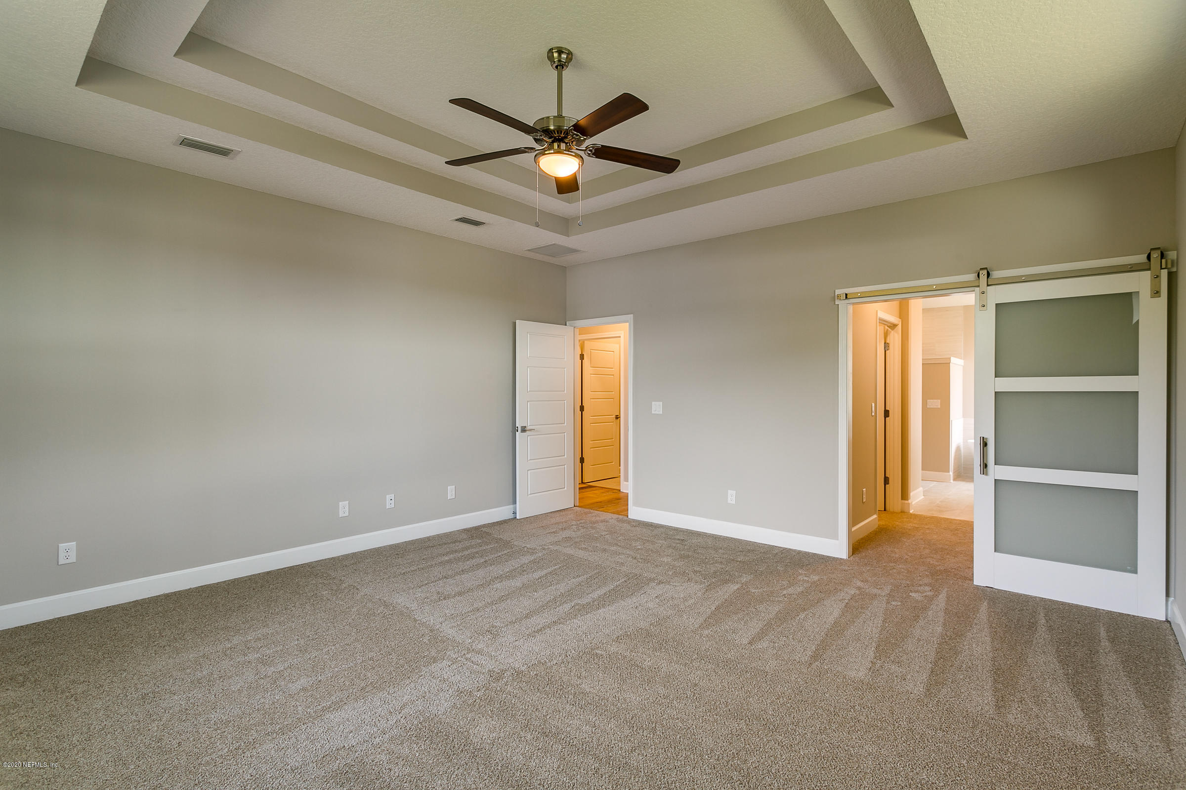 596 West Bianca Circle St. Augustine, FL 32086 - Photo 21 of 37 a view of an empty room with a ceiling fan